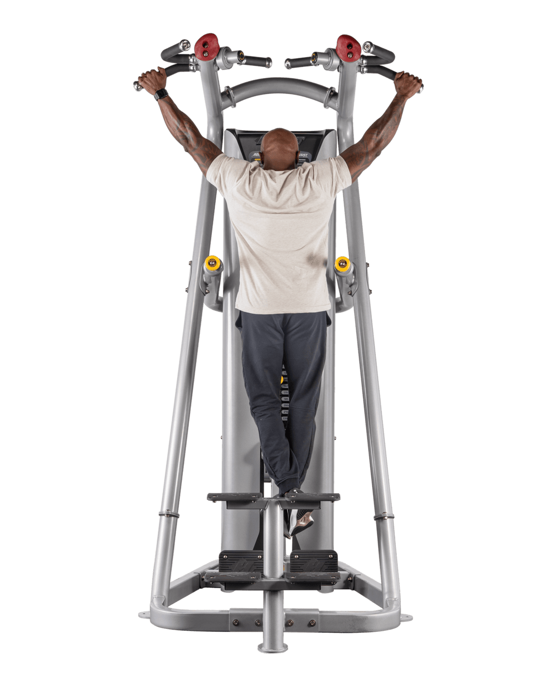 man gripping wide handles on chin assist machine preparing for pull-up exercise