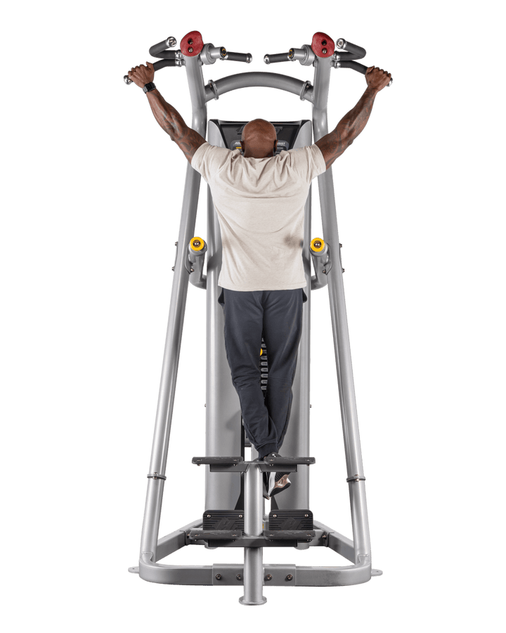man gripping wide handles on chin assist machine preparing for pull-up exercise