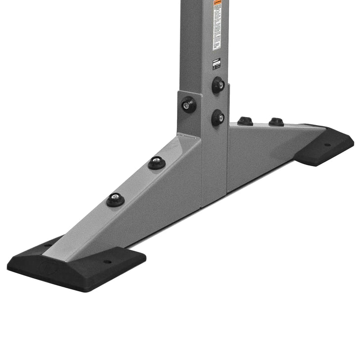 Close-up of X-CREATE 2-sided 8 ft upright in Platinum showing angled steel base feet with mounting holes.