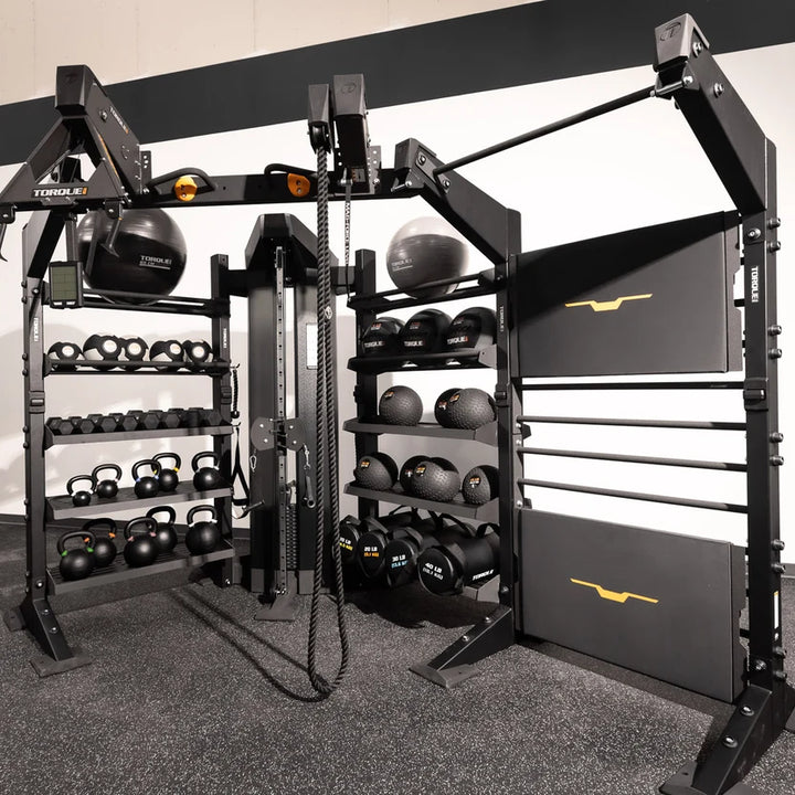 Torque X-CREATE corner storage cable component in Satin Black shown in a gym with integrated storage