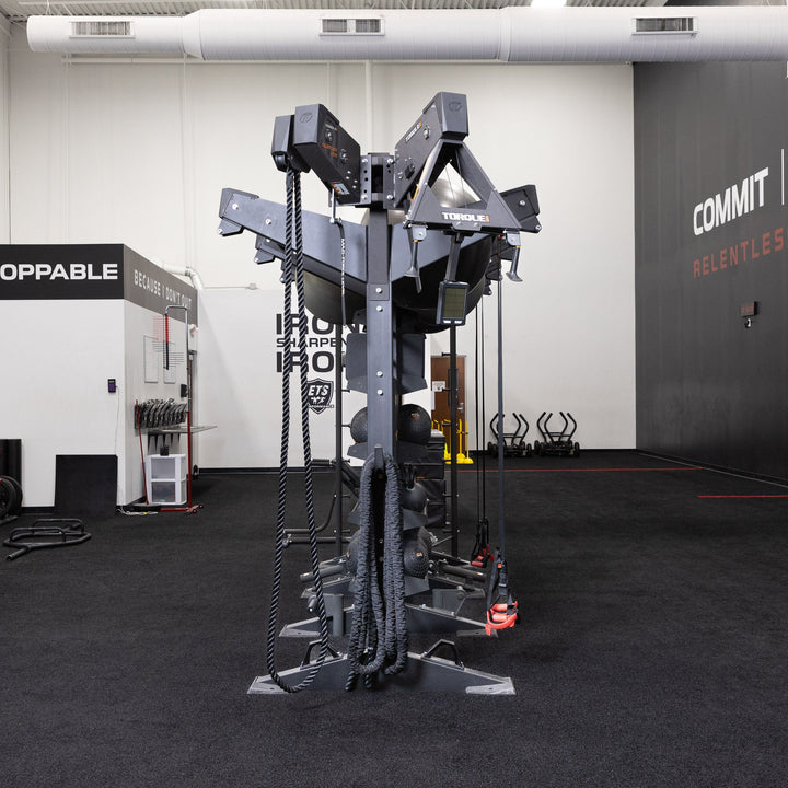 Torque USA X-CREATE side attachment mount with black double unit wedge installed on a rope training station in a gym.