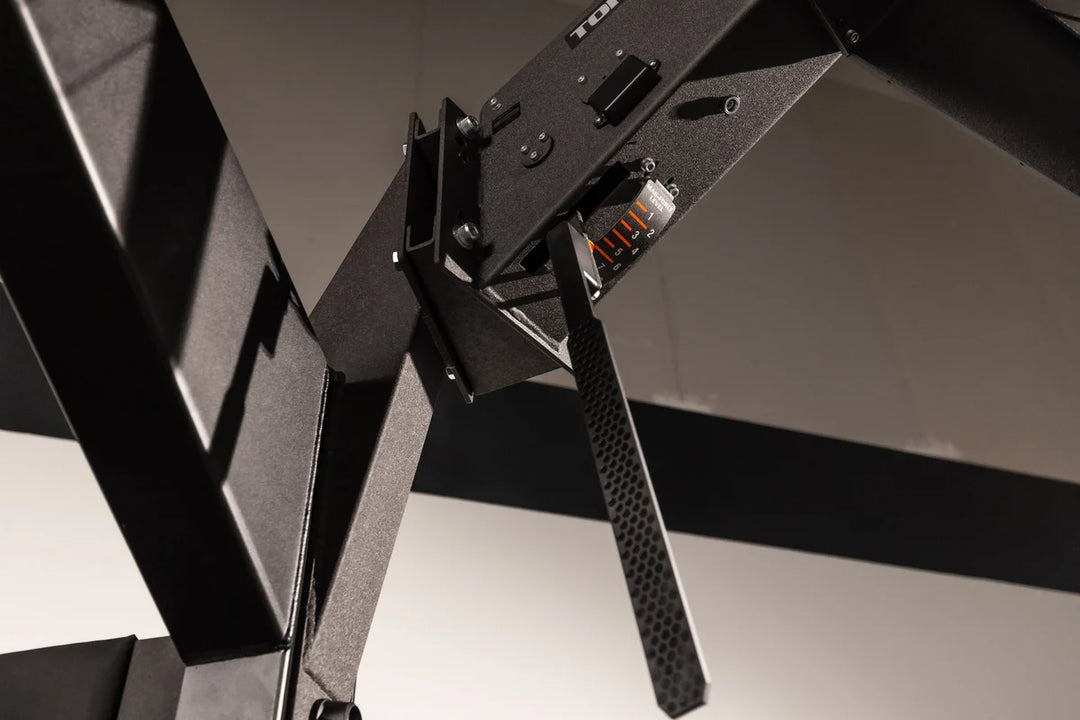 Close-up of the Torque USA X-CREATE side attachment mount in Black showing the installed wedge bracket and mounting hardware.