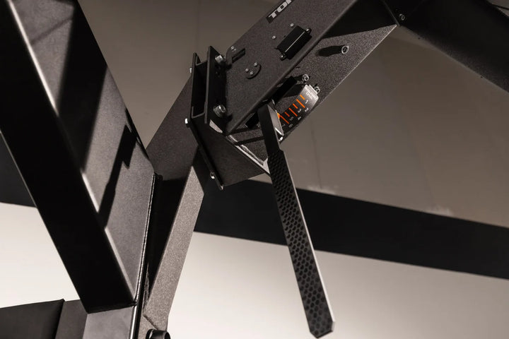 Close-up of the Torque USA X-CREATE side attachment mount in Black showing the installed wedge bracket and mounting hardware.