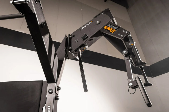 Torque USA X-CREATE side attachment mount with black single unit wedge connected to Relentless Ripper training equipment.