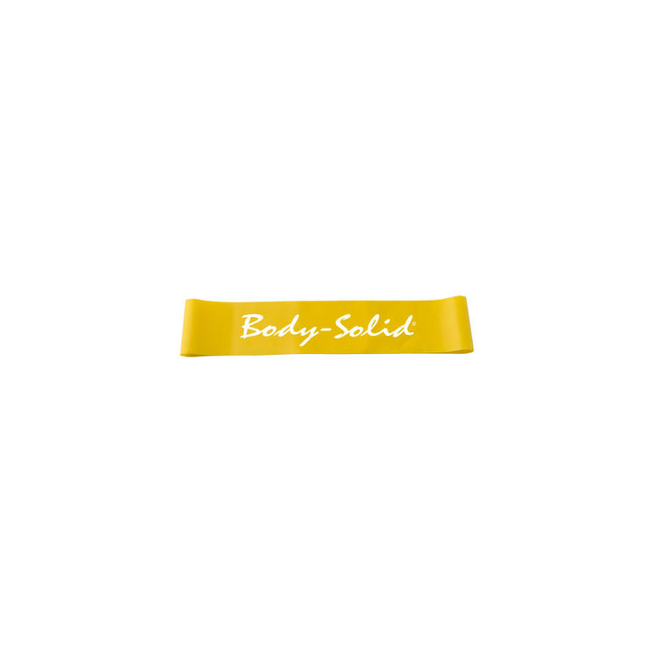 Yellow Body-Solid Tools mini resistance band representing very light resistance.