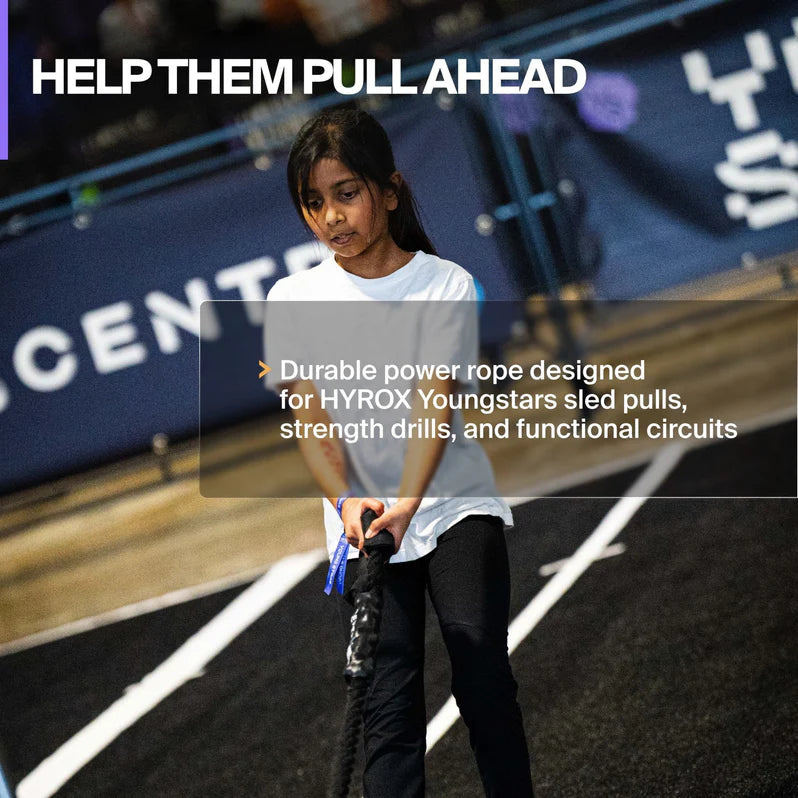 Athlete using the Centr x HYROX Competition Power Rope during HYROX Youngstars sled pull training.