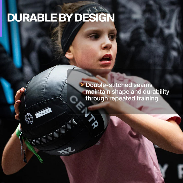 Close-up of the Centr x HYROX Youngstars Wall Ball showing its durable PVC construction.