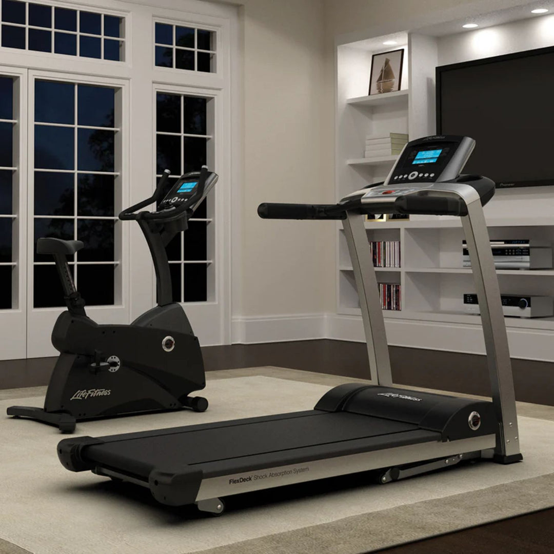 Cardio machine console with heart rate monitoring and LCD screen for home gym use