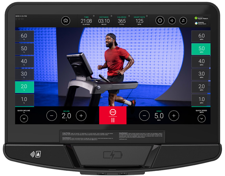 Life Fitness smart touchscreen console displaying interactive treadmill workout with runner video and real time metrics including speed incline and heart rate