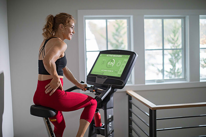 Matrix U30 upright bike with XUR console showing Sprint 8 program