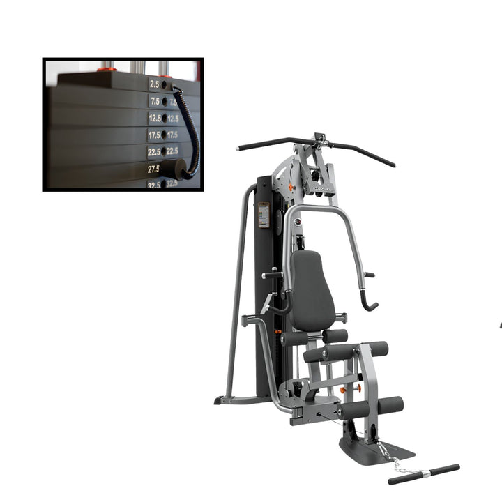 Life Fitness multi-station home gym with weight stack system showing full-body strength training setup and cable resistance use