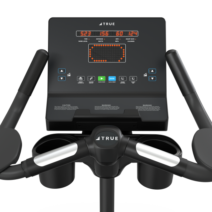 TRUE Fitness upright exercise bike console with workout display and controls