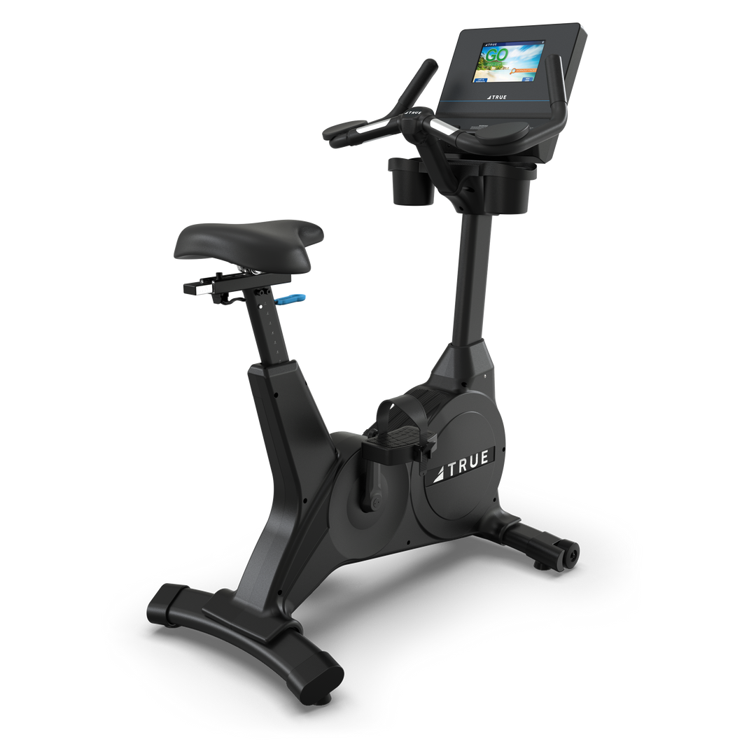 TRUE Fitness upright exercise bike shown from the front and side
